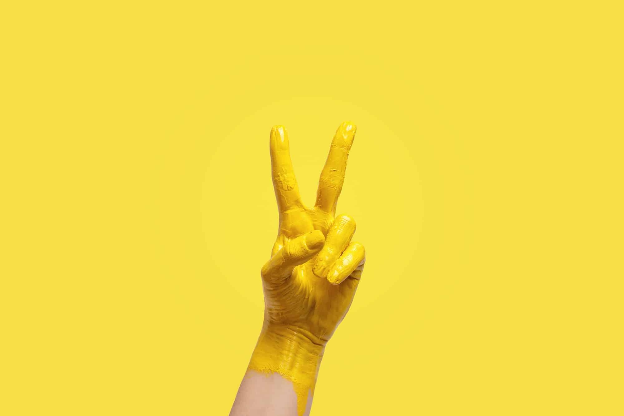 Victory or peace hand gesture, color of te 2021 year